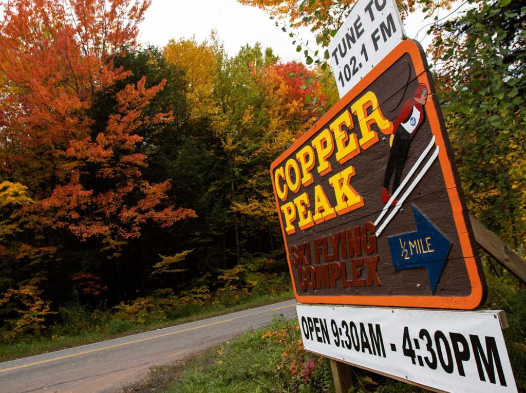 The Copper Peak main entrance sign during fall.