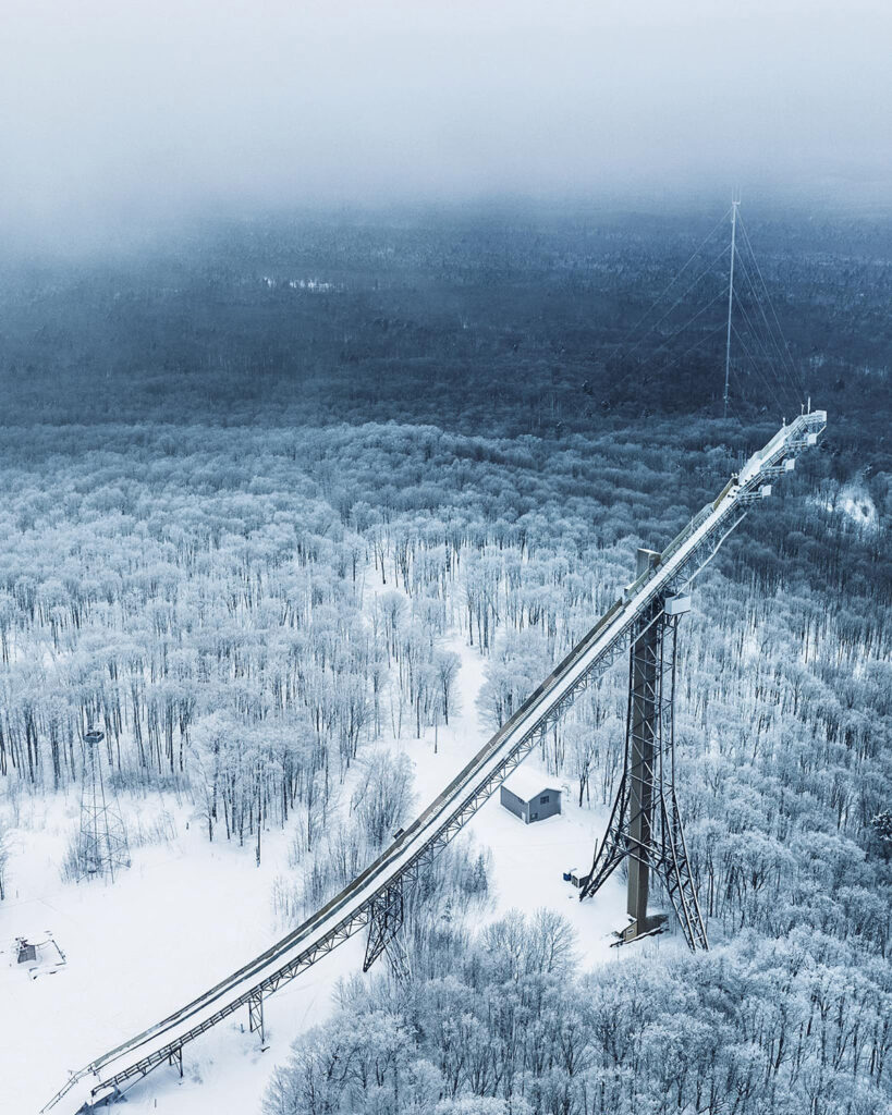 Copper Peak's ski jump in a snowy winter landscape.